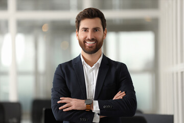 Wall Mural - Portrait of smiling man with crossed arms in office. Lawyer, businessman, accountant or manager