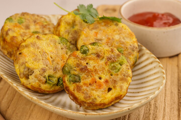 Wall Mural - Tortang Giniling is a Filipino Ground Beef Omelette, Like a Fritter, Filled with Ground Beef and Veggies.