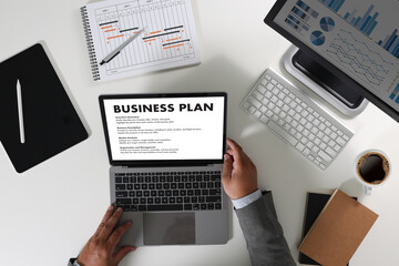 Poster - business plan Businessman at the office desk business document, plan, and project strategy With graphs and paperwork Growth Concept