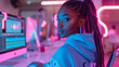 © BeautyStock - Young beauty woman black teenager woman girl works video editing streaming with computer in neon lights technology cyber studio