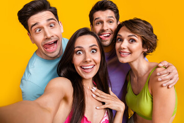 Canvas Print - Photo of carefree positive people friends make selfie doing grimace face stick tongue out isolated bright color background