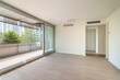 Expansive bare living space with entry to sizable balcony