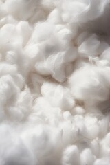 Poster - A detailed close-up view of a pile of white cotton. Suitable for textile industry and manufacturing concepts