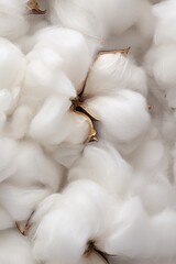 Poster - A pile of white cotton on a table. Suitable for textile industry and crafting projects