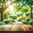 Empty wooden table top with blurred defocus natural green bokeh background, aesthetic creative design