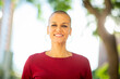 © mimagephotos - older woman with short hair smiling