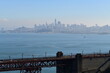 part of golden gate bridge with San Francisco in the background