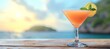 Vibrant tropical daiquiri cocktail with defocused beach background and text space