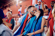 © Drazen - Couple of sports fans kissing during match at stadium stands.