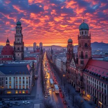 A Wide Road In A European City With A Beautiful Sunset Sky