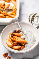 Canvas Print - Chia pudding with caramelized apples, pecan and cranberries. Winter vegan breakfast recipe.