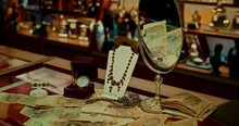 Inside Antique Shop With Jewelry, Money And Pocket Watch Of 19 Century, Closeup, 4K, Prores