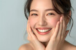 © Oksana - Closeup Beautiful smiling asian korean woman touch face with smooth healthy skin