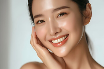 Wall Mural - Closeup Beautiful smiling asian korean woman touch face with smooth healthy skin