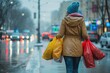 Close-up of a woman walking down the street carrying shopping bags, Belarus