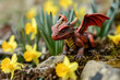 Saint David's Day Holiday celebration in Wales greeting card with a cute Red Welsh dragon in yellow daffodil flowers, space for text