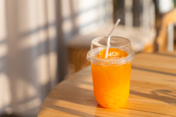 Wall Mural - fresh orange juice in plastic glass