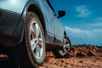 Canvas Print - Car wheel on sand close-up view