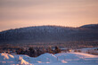 Winter landscape at sunset in Swedish Lapland.