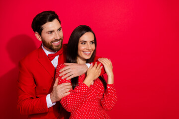Aufkleber - Photo portrait of stunning young couple hug look empty space valentine day dressed stylish elegant garment isolated on red color background