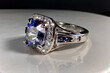 A platinum ring adorned with diamonds and a sapphire gemstone.