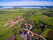 Aerial view of beautiful Radzieje village (former Rosengarten, East Prussia), Mamry, Labap and Dargin lakes in the background, Mazury, Poland