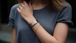 Permanent jewelry wristband with a minimalist metal design on a woman wrist