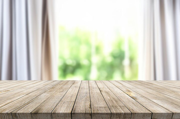 Wall Mural - Wooden table on window background with garden and trees