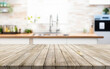 © Alernon77 - Wooden table or surface on the background of a beautiful kitchen