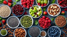 Fresh Fruit And Nut Assortment In Colorful Bowls On Dark Background.