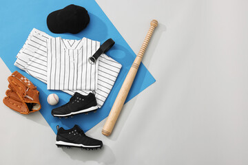 Wall Mural - Flat lay composition with baseball uniform and sports equipment on color background. Space for text