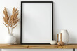 Essential aesthetics come to life: A square empty mock-up poster frame graces a wooden shelf, within a modern living room boasting white walls and carefully curated home decor pieces.