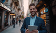 © Denis - portrait of a sympathetic businessman smiling at the camera and holding a tablet in his hand. Real estate agent.
