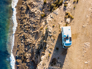 Canvas Print - Rv caravan on spanish rocky coast. Aerial view