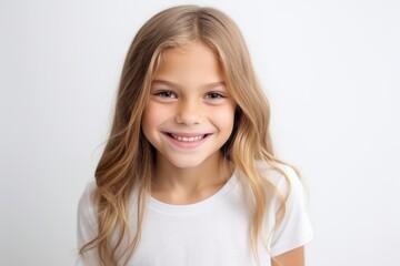 Canvas Print - Portrait of a cute little girl smiling and looking at the camera