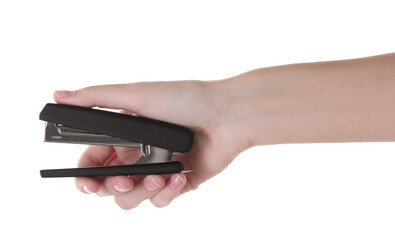 Wall Mural - Woman holding black stapler on white background, closeup