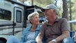 © Barbara Taylor - close up of mature couple sitting next to their RV,