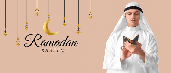 Wall Mural - Young Muslim man with Koran on beige background. Banner for Ramadan