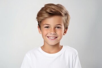 Canvas Print - portrait of a cute smiling little boy in a white t-shirt