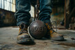 An iron ball with the ANXIETY title, on a chain at the feet. Pointing to a bad mental state, depression and anxiety.