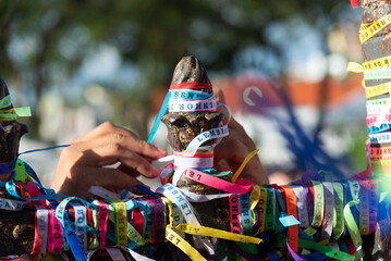 Wall Mural - People are seen paying homage to Senhor do Bonfim by tying a souvenir ribbon on the church's iron railing. City of Salvador, Bahia.