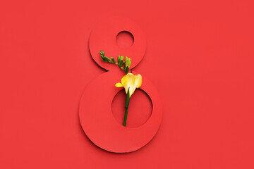 Figure 8 made of paper and beautiful flower on red background. International Women's Day