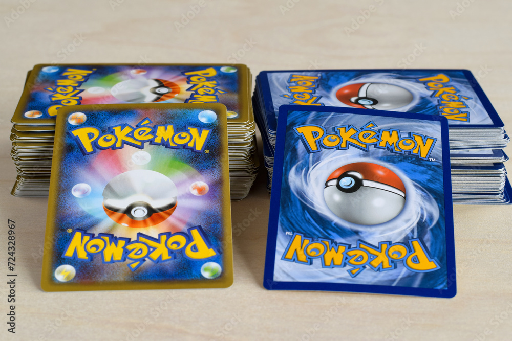 Two stacks of Pokemon trading game cards with different backs Stock ...