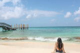 Fototapeta Krajobraz -  woman resting on San Andres, Colombia beaches, on a sunny and hot day, with the blue Caribbean sea