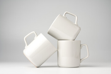 Wall Mural - Blank white mugs mock up on white background