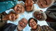 Group of joyful seniors laughing together against a clear sky.