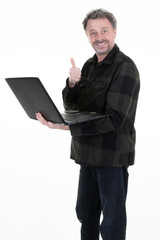 Wall Mural - Smiling handsome professional man fifties middle age work pc laptop and standing on white background