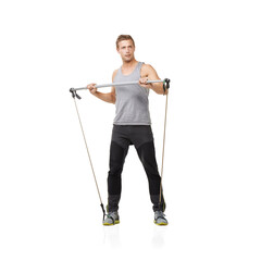 Wall Mural - Gym, fitness and resistance band with a strong man in studio isolated on a white background for health. Idea, exercise or performance and a young athlete training with equipment for wellness