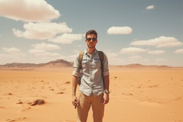 Sticker - A solitary man stands alone in the middle of a barren desert, surrounded by endless stretches of sand, Male tourist standing in front of a sandy desert, full body, AI Generated