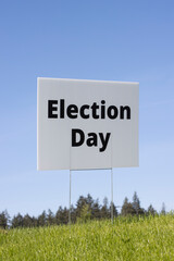 Wall Mural - Election Day lawn sign against clear blue sky background.